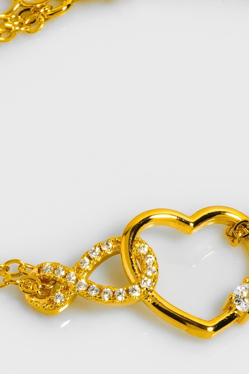PULSEIRA ELO INFINITO CRAVEJADO EM ZIRCÔNIAS COM CORAÇÃO ENTRELAÇADO OURO