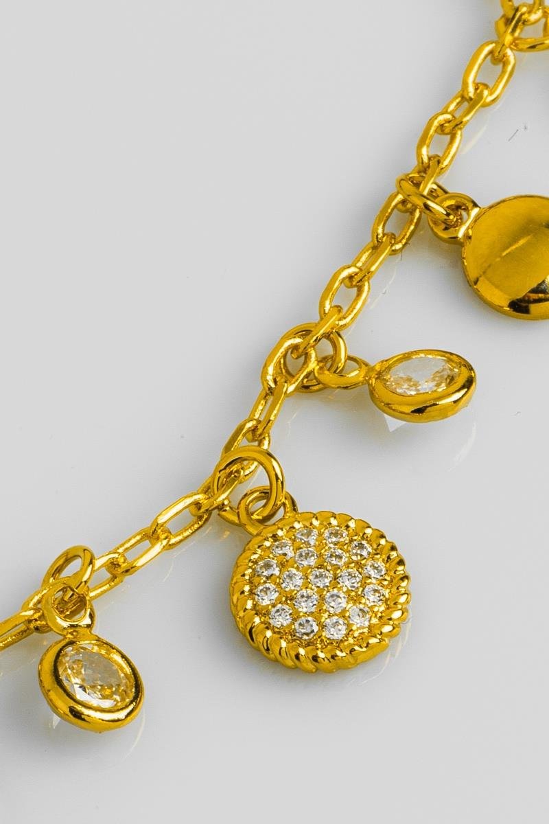PULSEIRA COM PINGENTES REDONDOS CRAVEJADO EM ZIRCÔNIAS LISO ELO OVAL OURO
