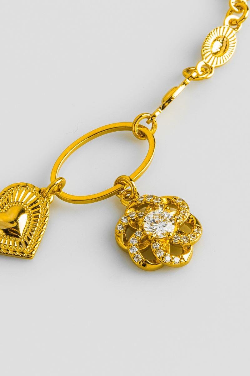 PULSEIRA COM FLOR CRAVEJADA EM ZIRCÔNIAS CORAÇÃO DIAMANTADO ELO OVAL OURO