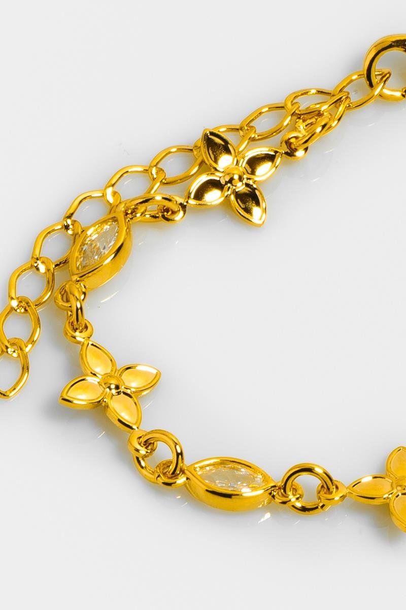 PULSEIRA COM FLOR LISA NAVETE ZIRCÔNIAS OURO